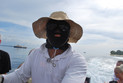 Bootsführer mit Sonnenschutz